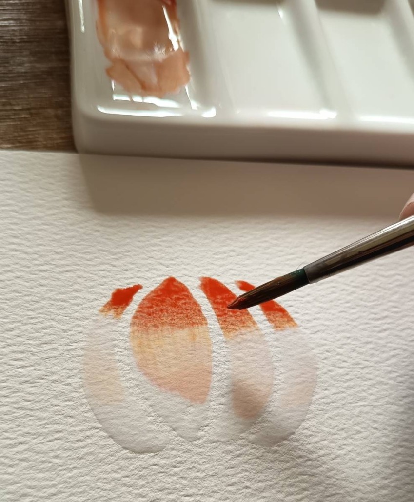 Beispielbild für den Workshop "Aquarell - Herbstzauber & Winterglanz" mit Laura aus dem Siepen von der Kreativagentur Farbtier in den Bücherträumen in Mülheim an der Ruhr. Hier wird ein Kürbis gemalt.